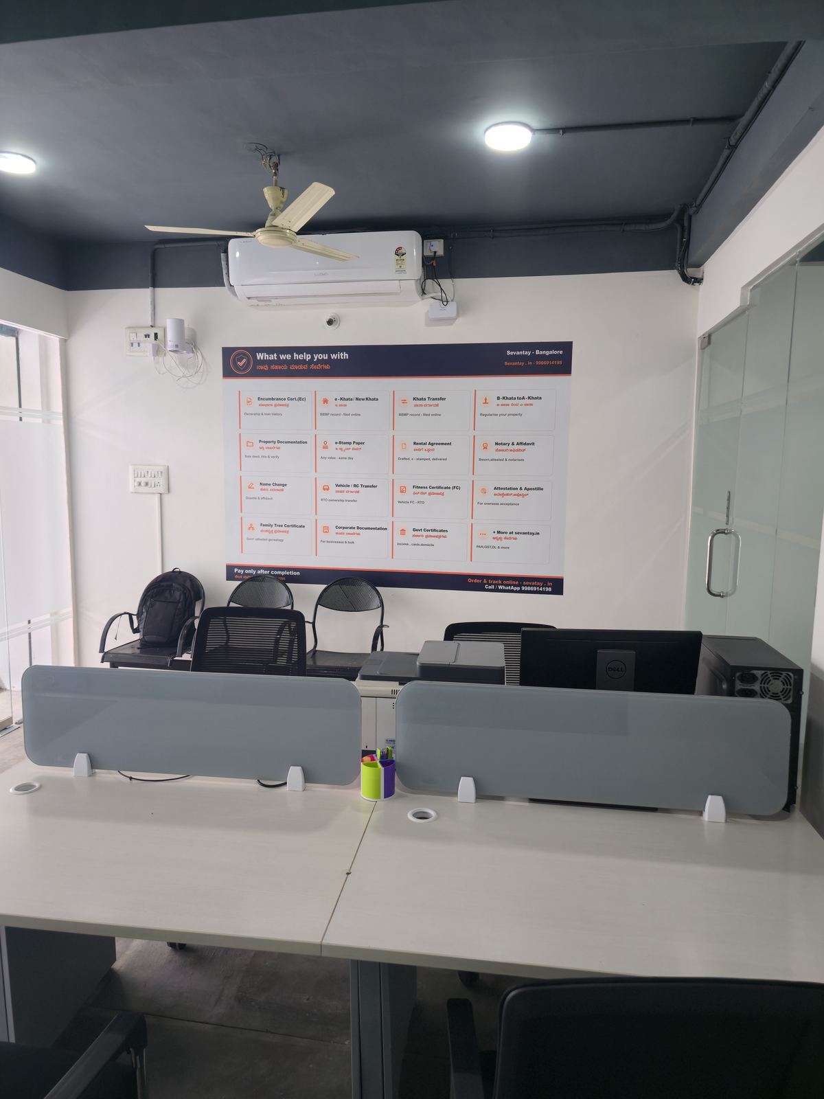 Inside the Sevantay office in J. P. Nagar — work desks and the services board